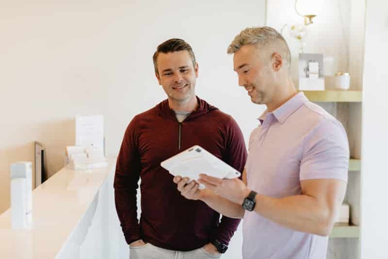 Customers checking out the available treatments