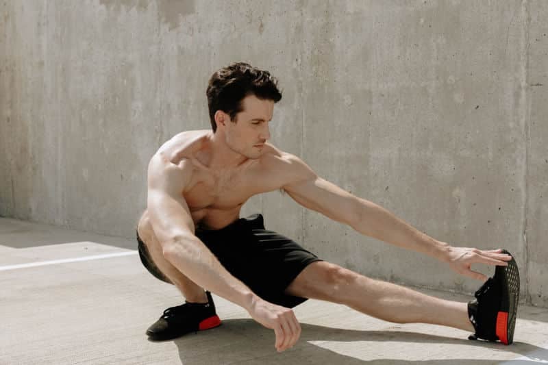 Man doing leg stretching