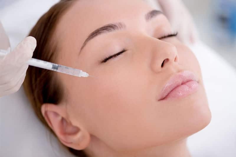 Young lady getting cosmetic injections. Young lady getting cosmetic injectables.